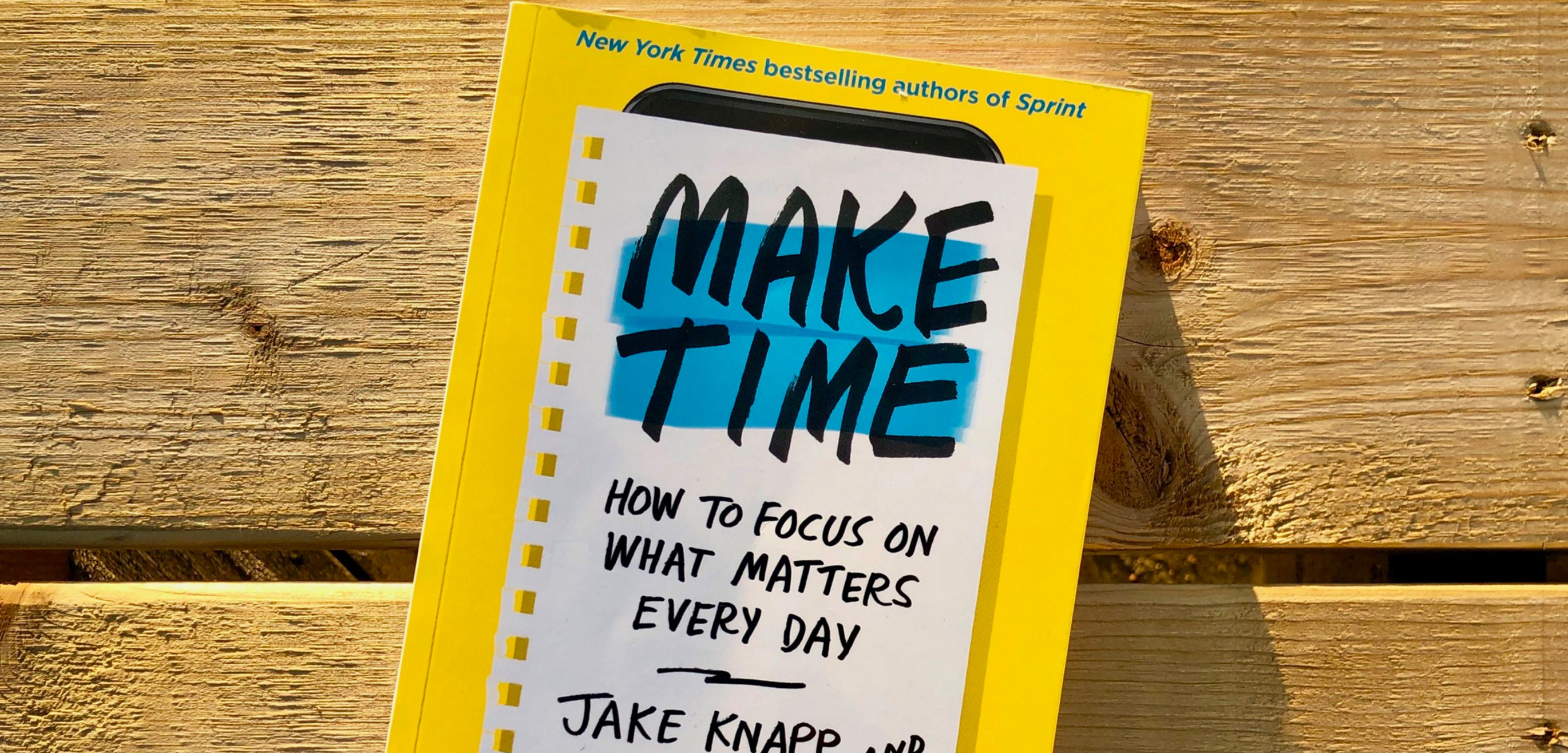Make time book on wood table by Jake Knapp